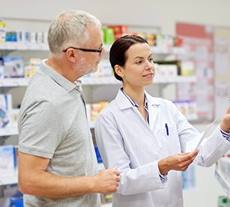 Pharmacist helping patient